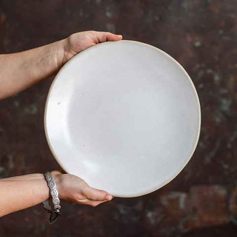 Holding a Chantilly Dinner Plate in front of a Copper Backdrop