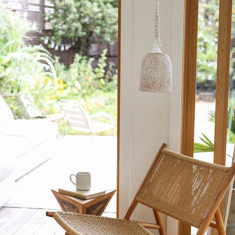 Ceramic Pebble Bell Pendant in a Living Room.