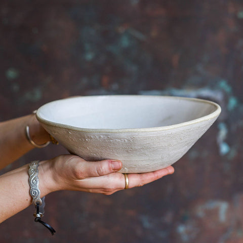 Holding a Chantilly Serving Bowl, showcasing the circular line texture on its exterior.