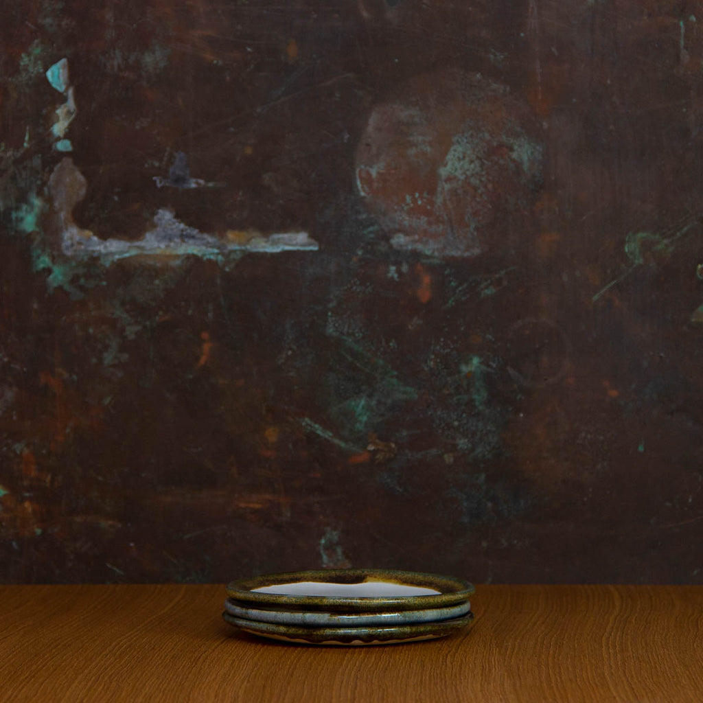 Stack of three Handmade Cafe Plates Glazed in Inkblot: Elegant White Side Plate with Striking Black Rim