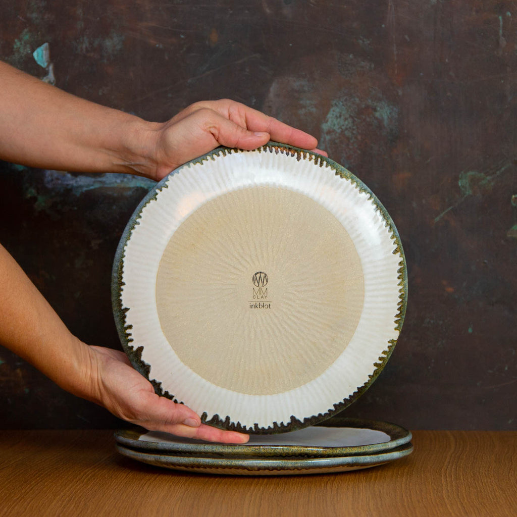 Bottom of a Handmade Dinner Plate Glazed in Inkblot: Elegant White Plate with Striking Black Rim