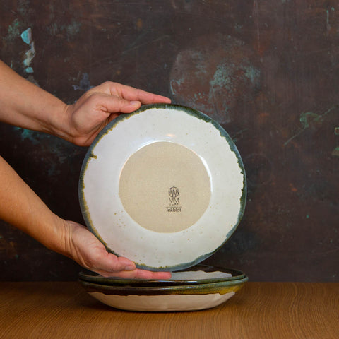 Bottom of Handmade Flat Bowl Glazed in Inkblot: Elegant Shallow White Bowl with Striking Black Rim