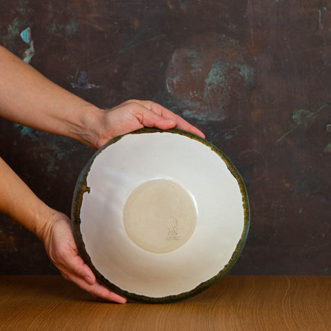 Bottom of Inkblot Glazed Handmade Serving Bowl. Large deep bowl, glazed White with Contrasting Black Rim