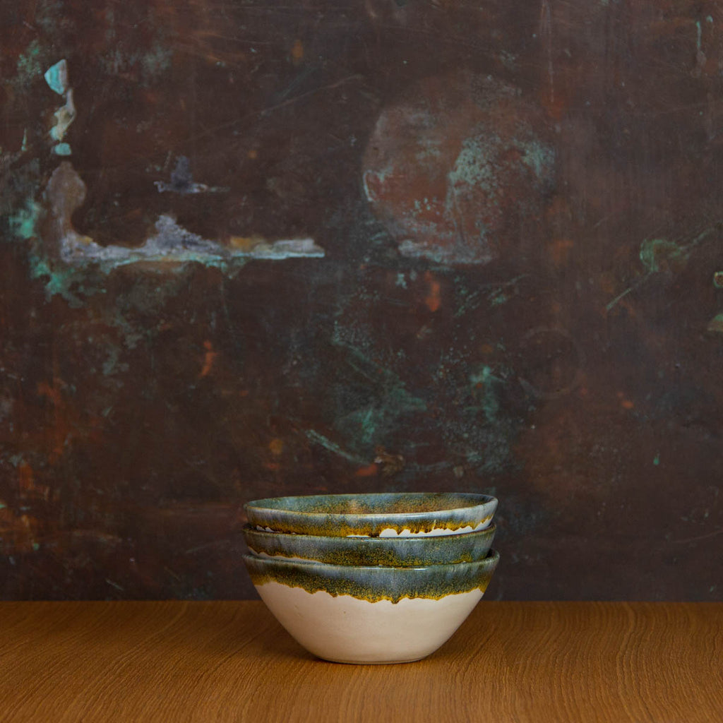 Stack of Handmade Cereal Bowls Glazed in Inkblot: Elegant White Bowl with Striking Black Rim